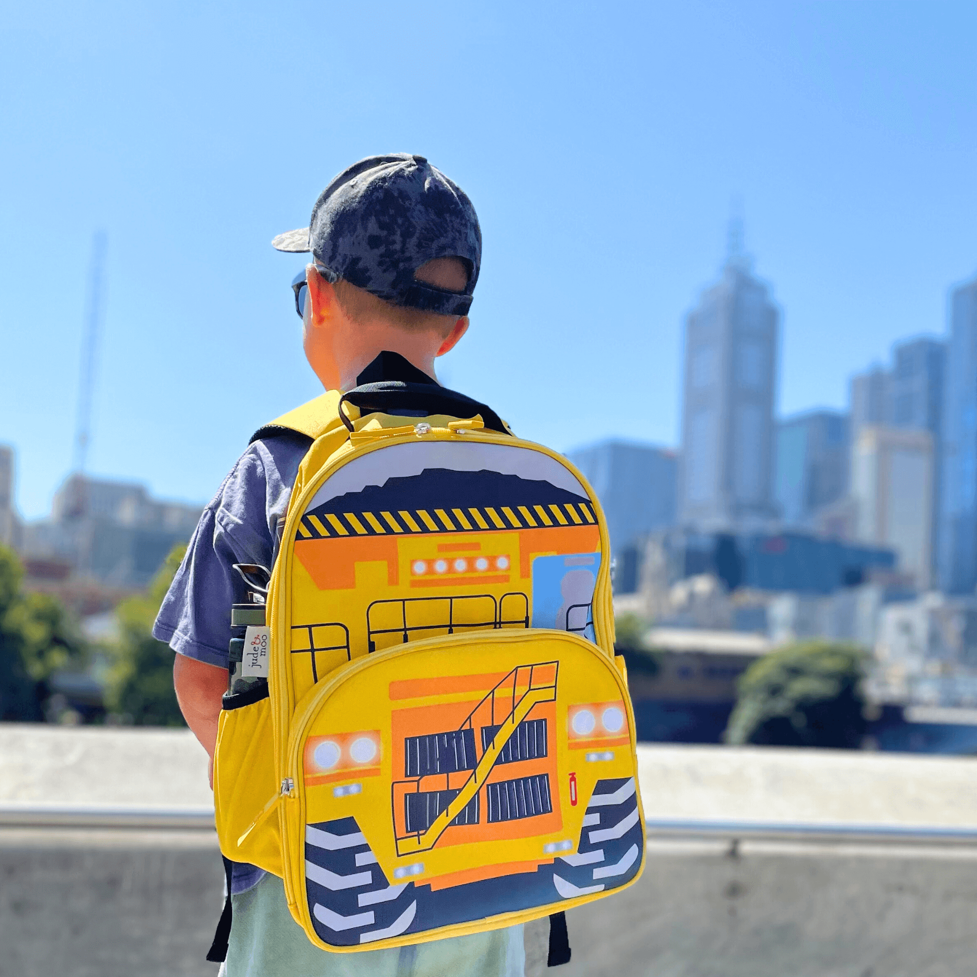 Boy in Melbourne wearing jude&moo Australia Yellow Mining Dump Truck Kids Backpack